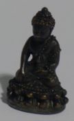 A miniature bronze Buddha