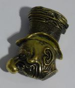 A brass vesta formed as Schnozzle Durante