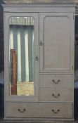 An Edwardian painted wardrobe, bevelled full length mirror,