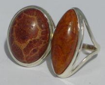 Two silver and coral rings