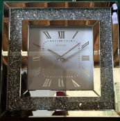 A mirrored wall clock