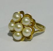 A 14 K gold pearl set flower head ring (4 grammes all in)