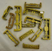 A quantity of miniature brass fenders