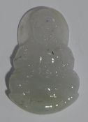 A jade pendant in the form of Buddha