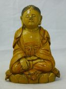 A Chinese earthenware Buddha,