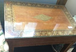 A small Edwardian table with marquetry top