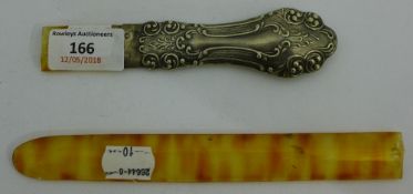 A white metal handled letter opener/page turner,