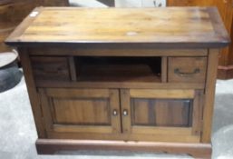 A hardwood cabinet/TV stand and a student's bureau