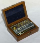 A 19th century mahogany cased set of weights