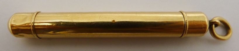 A yellow metal retracting pencil,