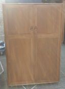 A blonde Ercol wardrobe