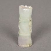 A Chinese carved celadon jade group Worked as a section of bamboo. 7.5 cm long.