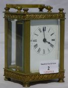 A brass cased carriage clock by Harrods Ltd