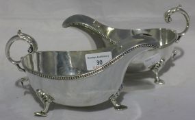 A pair of silver plated sauce boats