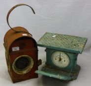 A vintage set of scales and a lantern