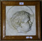 A plaster profile portrait of a child,