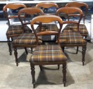 Six Victorian balloon back chairs upholstered in a tartan fabric