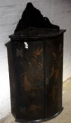 A 19th century black japanned hanging corner cupboard