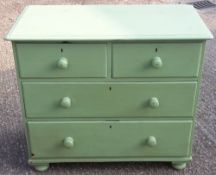 A Victorian green painted pine two over two chest drawers,