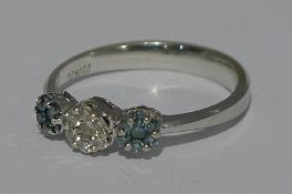 A 14 K white gold triple cluster ring set with fancy blue and white diamonds