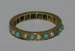 A 9 ct gold turquoise and seed pearl full eternity ring