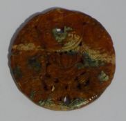 A Chinese carved hardstone roundel