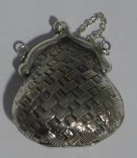 A miniature silver purse