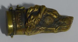 A brass vesta in the form of a dog's head