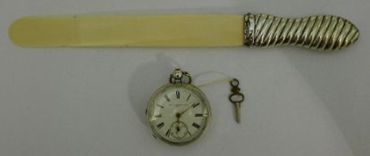 A late 19th century silver pocket watch and a silver and ivory letter open,