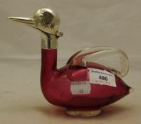 A silver plated and cranberry glass duck form decanter