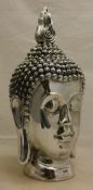 A silvered Buddha head