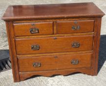 An early 20th century oak dressing chest