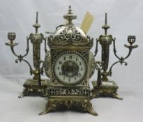 A French silvered bronze three piece clock garniture