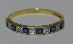 An Art Deco 18 ct gold and platinum sapphire and diamond set half eternity ring