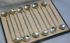 Twelve pierced Chinese straw spoons