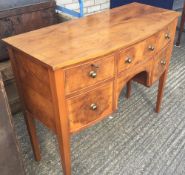 A modern yew wood sideboard