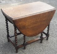 An oak barley twist gate leg table