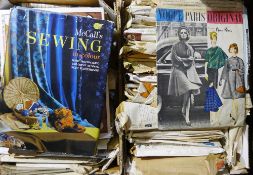 A collection of vintage dress patterns and a book on sewing