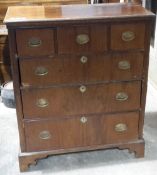 A Georgian walnut and mahogany chest of drawers