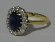 An 18 ct gold sapphire and diamond ring