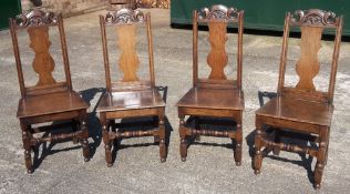 A set of four Georgian oak solid seated chairs