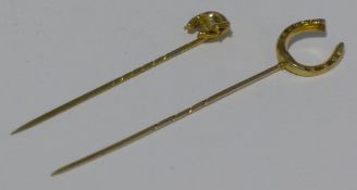 Two unmarked gold stickpins
