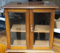 A small Victorian glazed mahogany cabinet