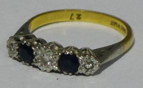 An 18 ct gold diamond and sapphire five stone ring (3 grammes all in)