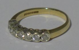 A 9 ct gold seven stone diamond ring