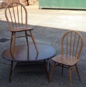 An Ercol coffee table and two Ercol chairs