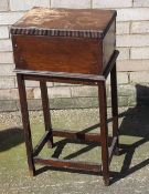 An early 20th century oak sewing box