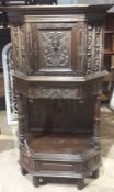 A 19th century carved oak cupboard