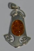 A silver Art Nouveau style pendant