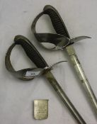 A pair of swords and a plaque, inscribed ''G. L.